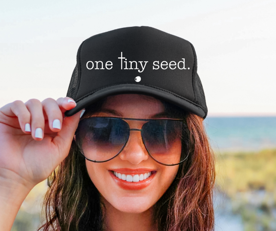 One Tiny Seed Trucker Cap